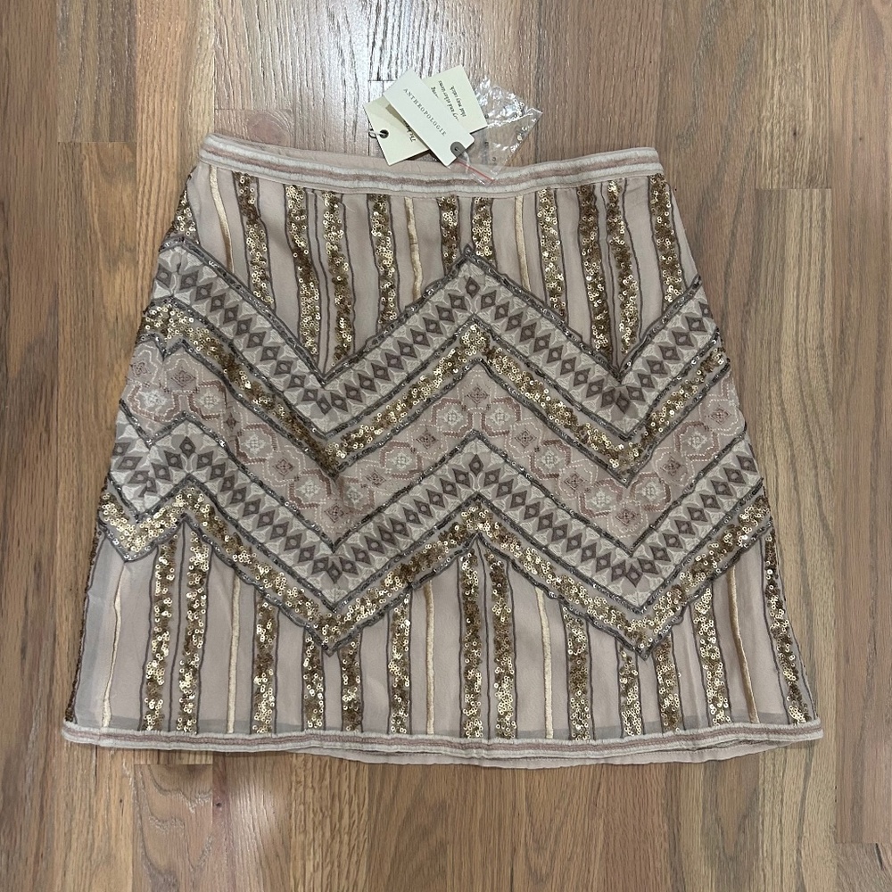 Sequined and lace mini skirt.